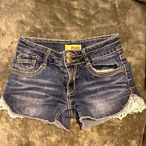 Girls Jean shorts with white fabric sewn on outside